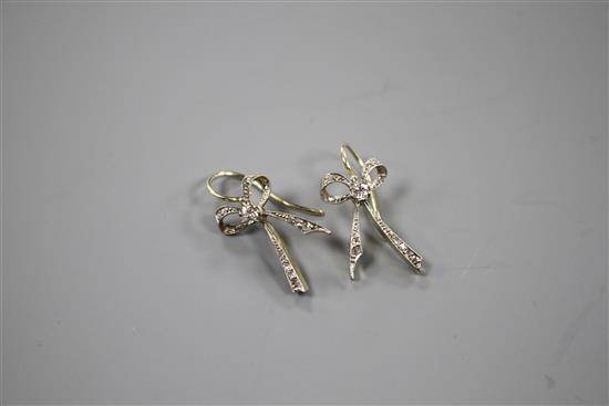 A pair of 20th century yellow metal and diamond set ribbon bow drop earrings, bow 22mm, gross weight 3.8 grams.